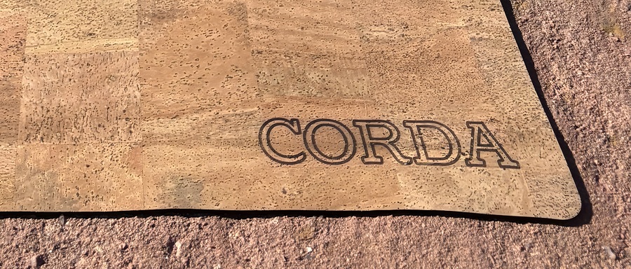 Close-up of the Corda One cork surface texture and CORDA corner engraving