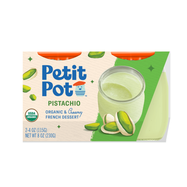 A small glass pot of creamy pistachio dessert