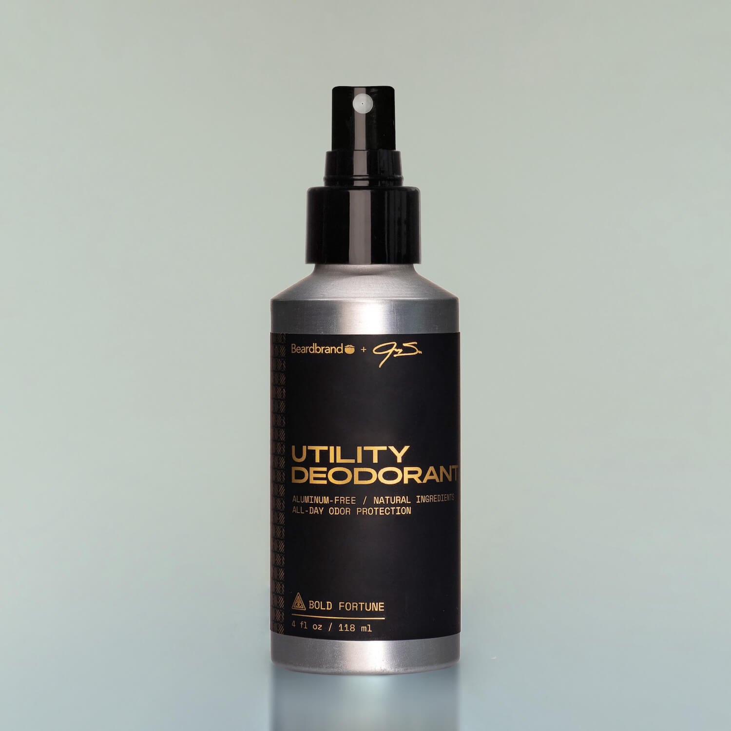 A stick of Bold Fortune Utility Deodorant on a wooden background