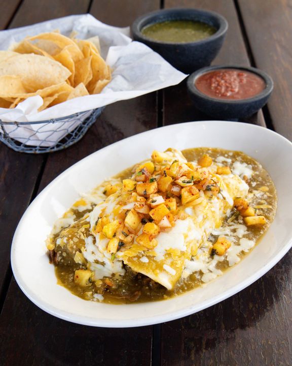 A carnitas burrito wrapped in a warm tortilla