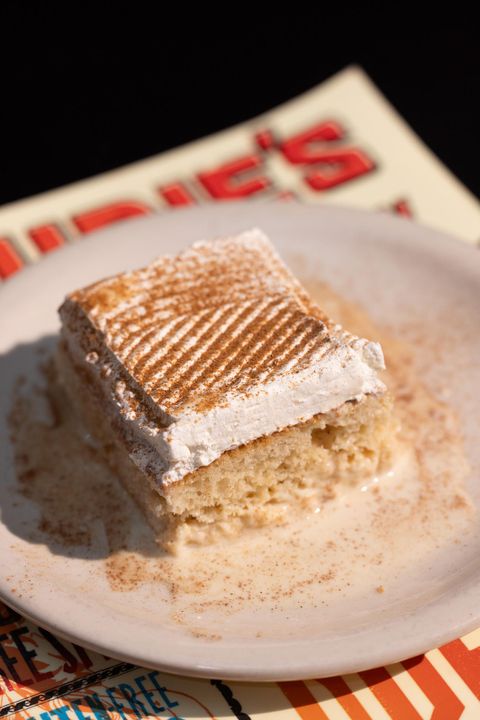 A slice of tres leches cake on a plate