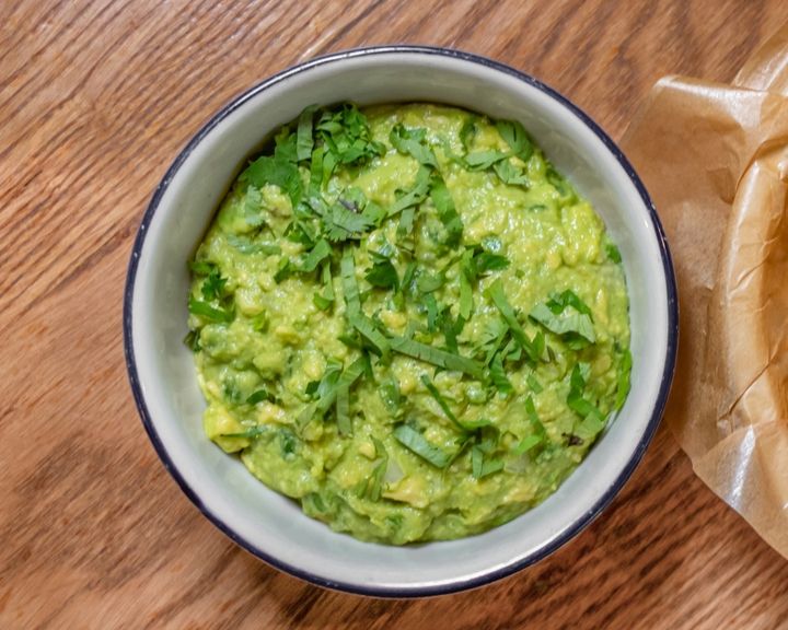 A container of creamy Classic Guacamole