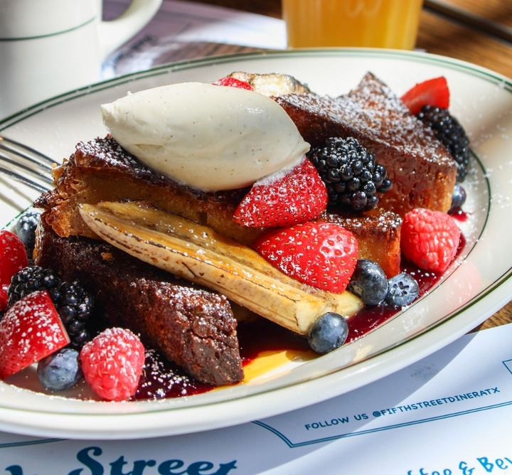 A stack of golden-brown French toast on a plate