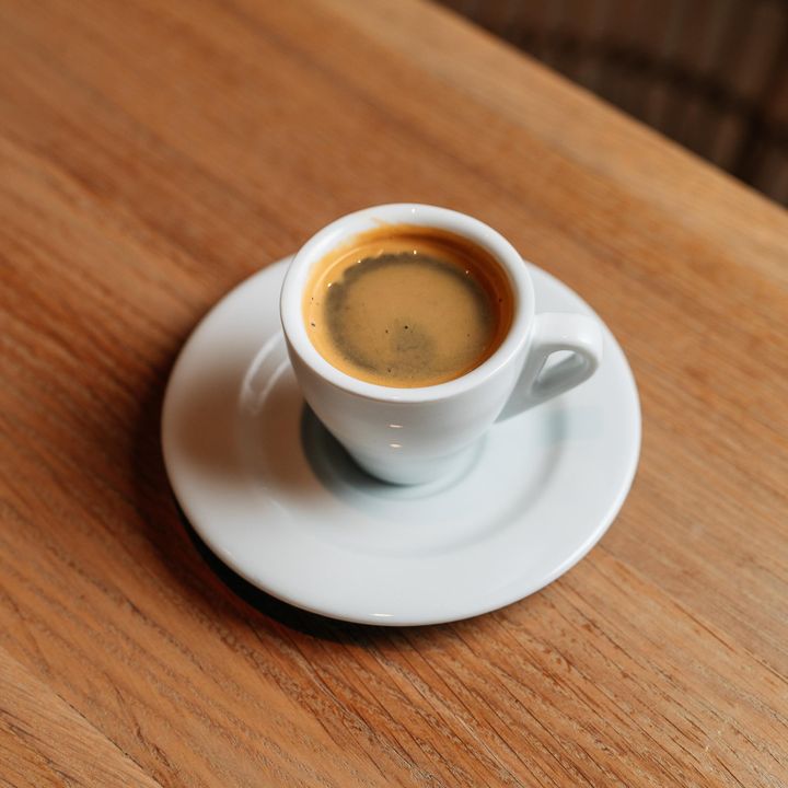 A shot of espresso in a small cup