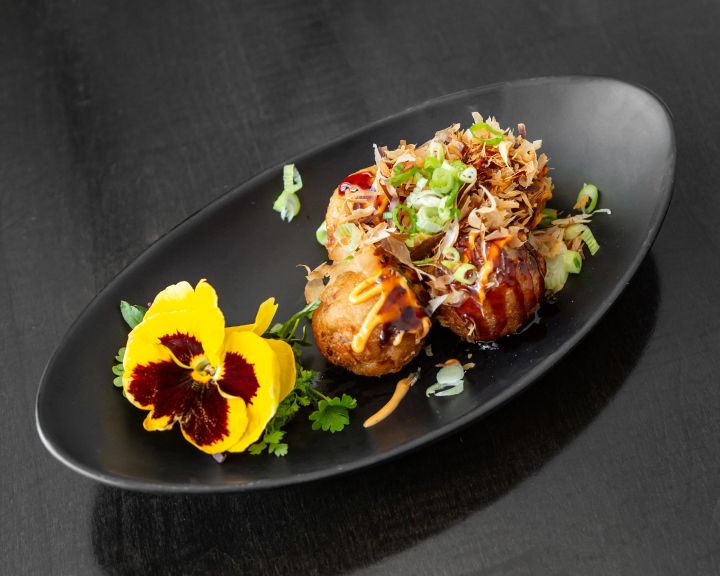 Photo of Maiko's takoyaki, crispy fried balls filled with octopus and tempura bits