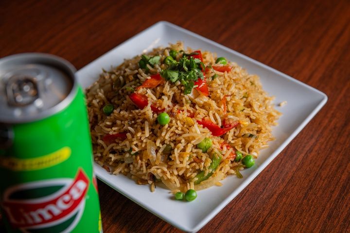 A serving of Shrimp Fried Rice in a white container