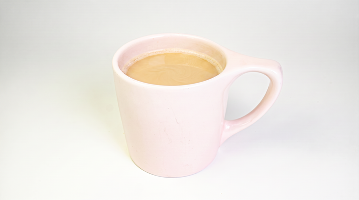 A cup of Cafe Au Lait from Neon Belly Coffee & Bakery