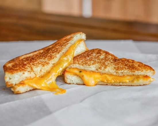 Photo of a grilled cheese sandwich cut in half