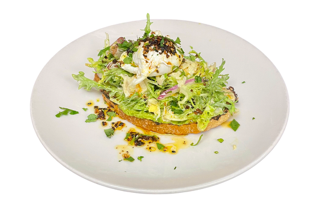 A toasted slice of bread topped with mashed avocado and a sprinkle of red pepper flakes