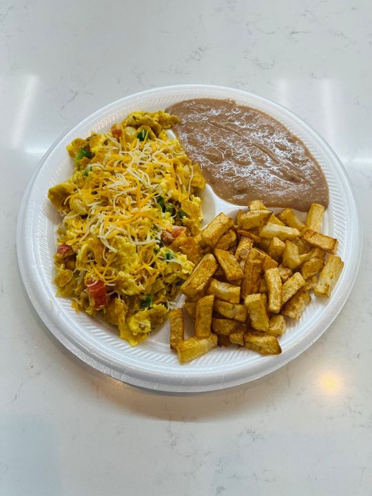 Photo of Migas Plate with tortilla chips, cheese, and salsa